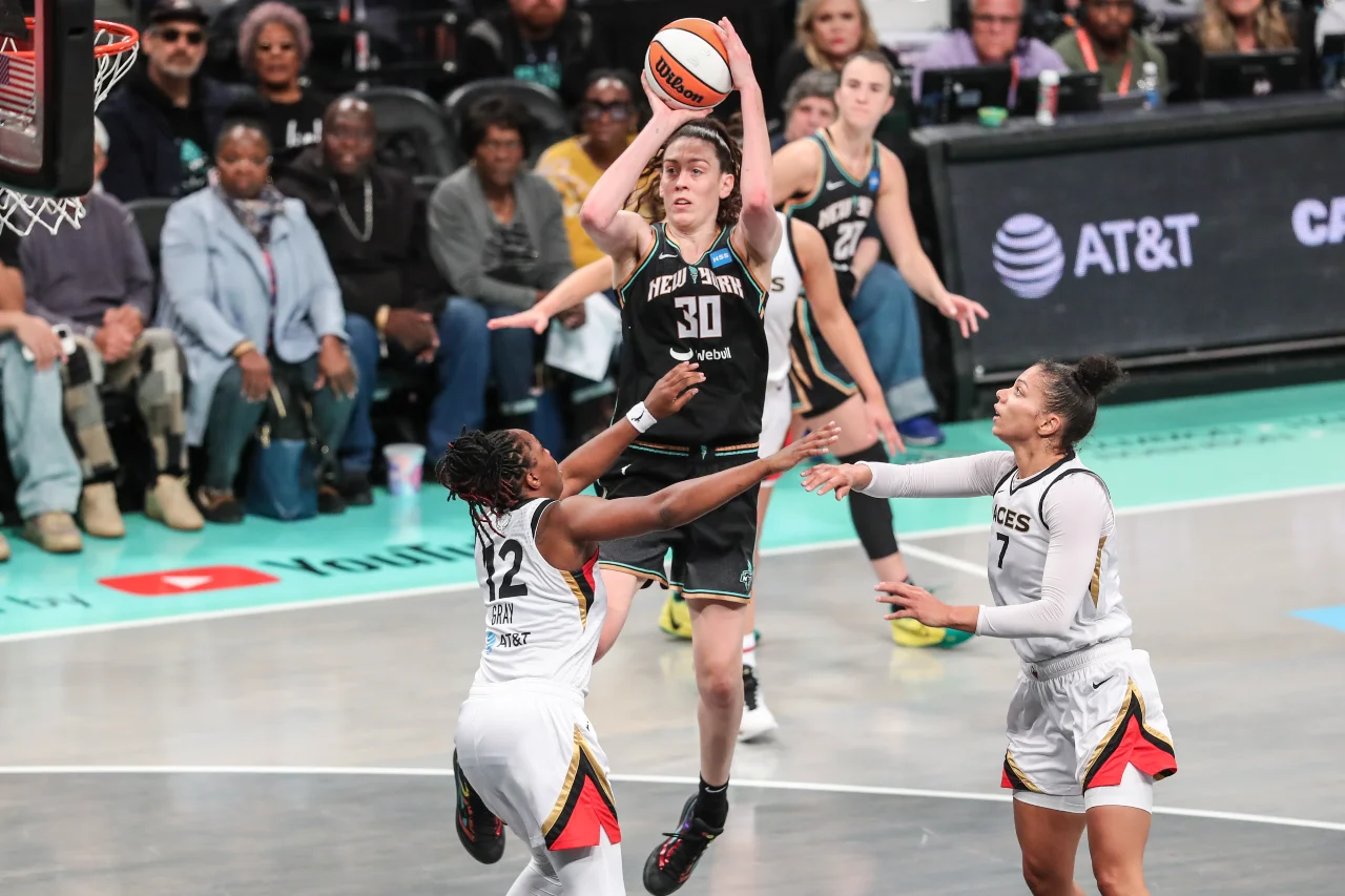 New York Liberty forward Breanna Stewart (30) shoots over Las Vegas Aces guard Chelsea Gray (12) and forward Alysha Clark (7) in the fourth quarter during game three of the 2023 WNBA Finals at Barclays Center.