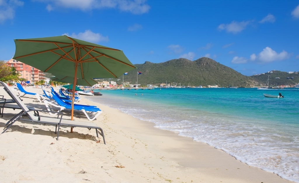 Pristine waters of Great Bay Beach with reclining chairs