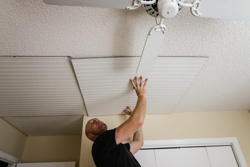 Placing bead board on ceiling