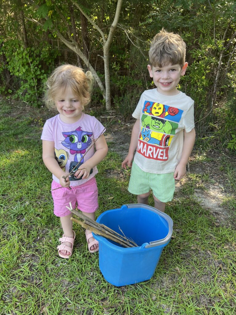 Kids searching for natural materials for bug hotel