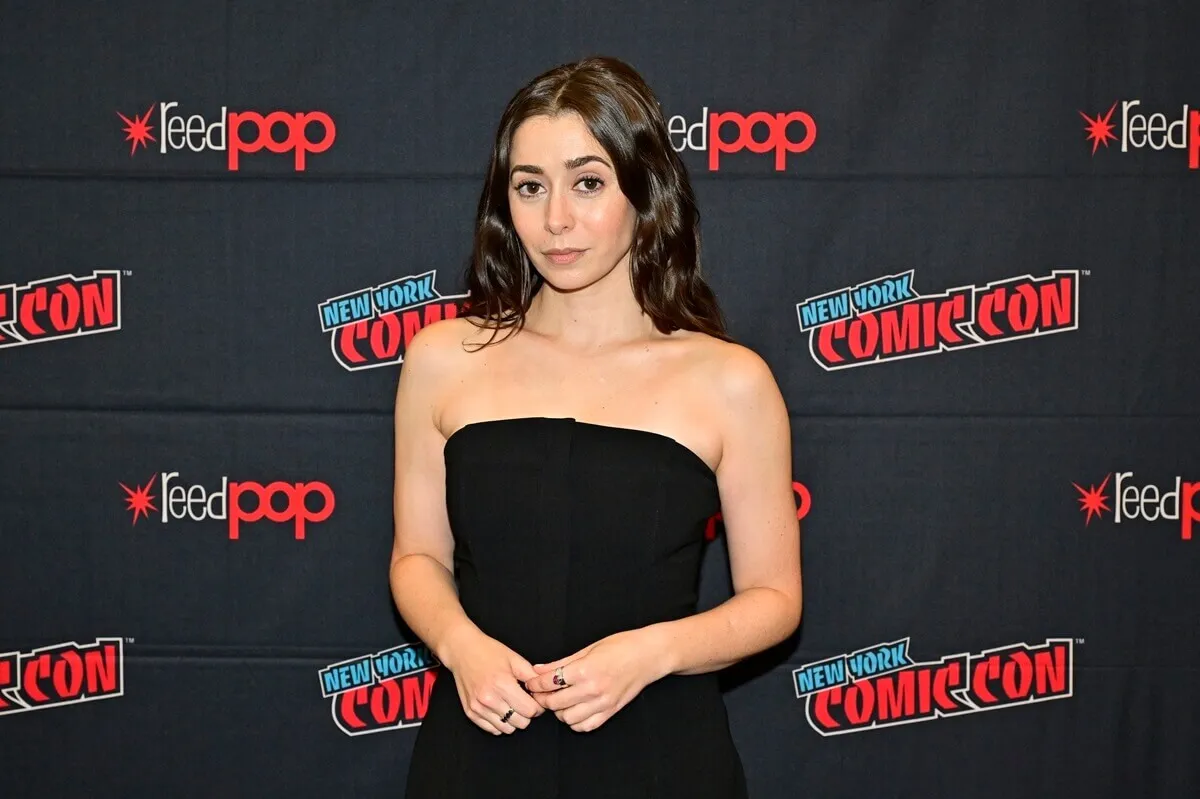 Cristin Milioti posing in a black dress at New York Comic Con.