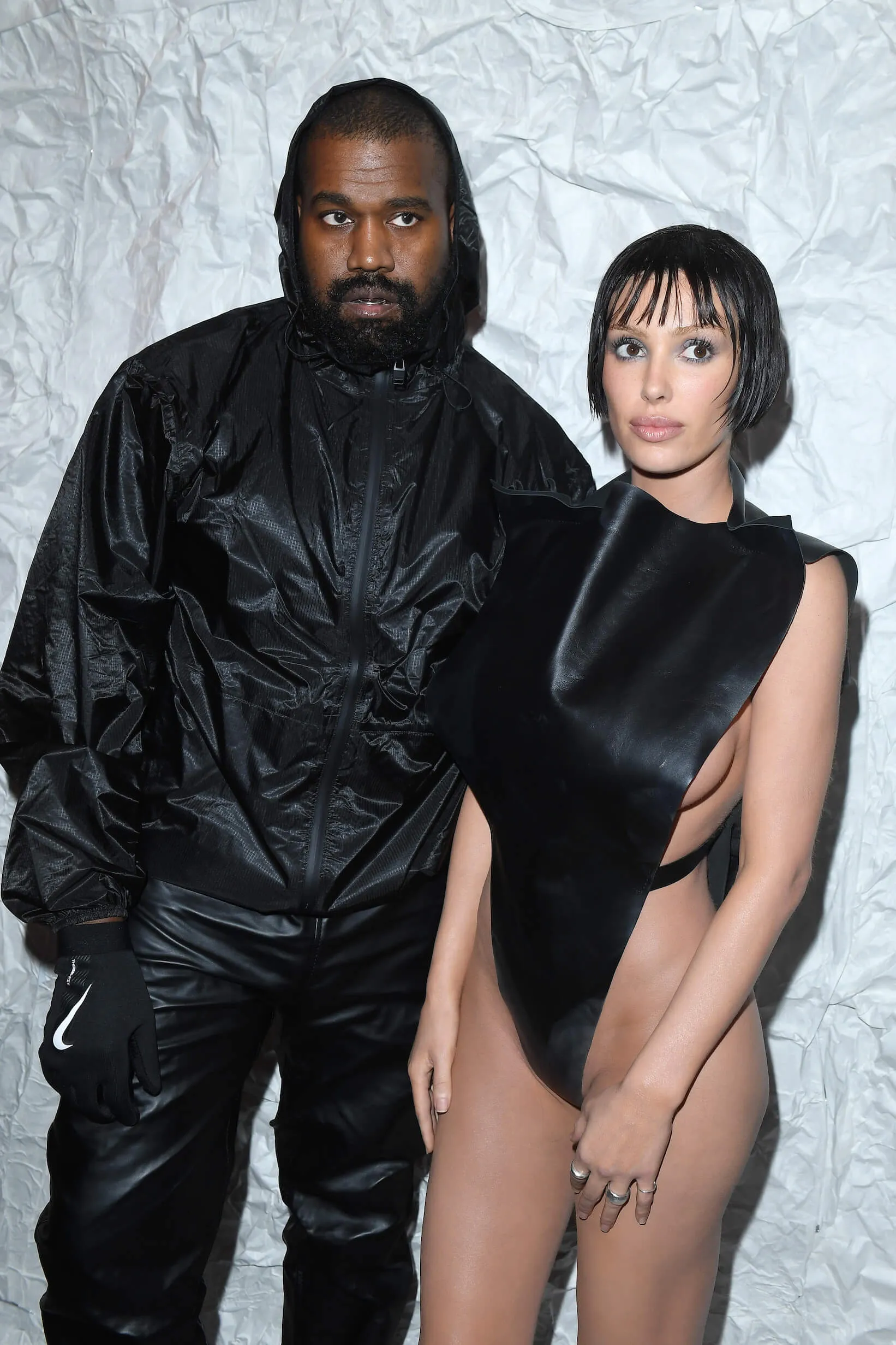 Kanye West and Bianca Censori dressed in black and posing