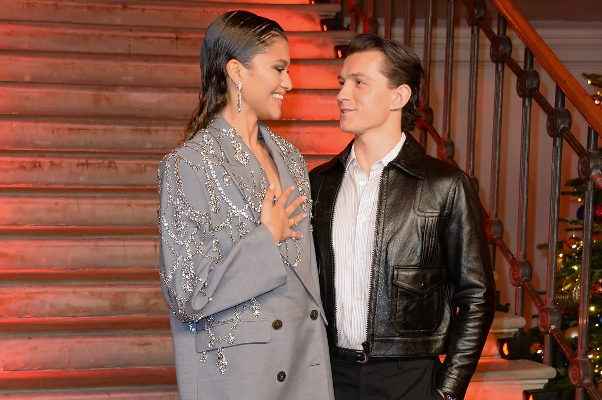 Zendaya and Tom Holland pose at a photocall for "Spider-Man: No Way Home" at The Old Sessions House on December 5, 2021 in London, England