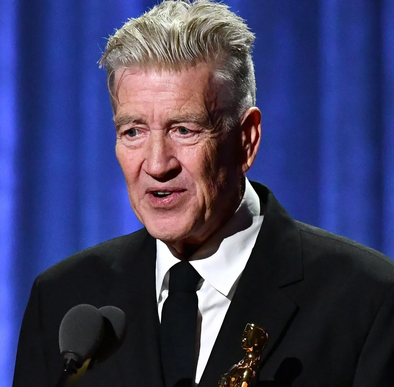 David Lynch wearing a suit