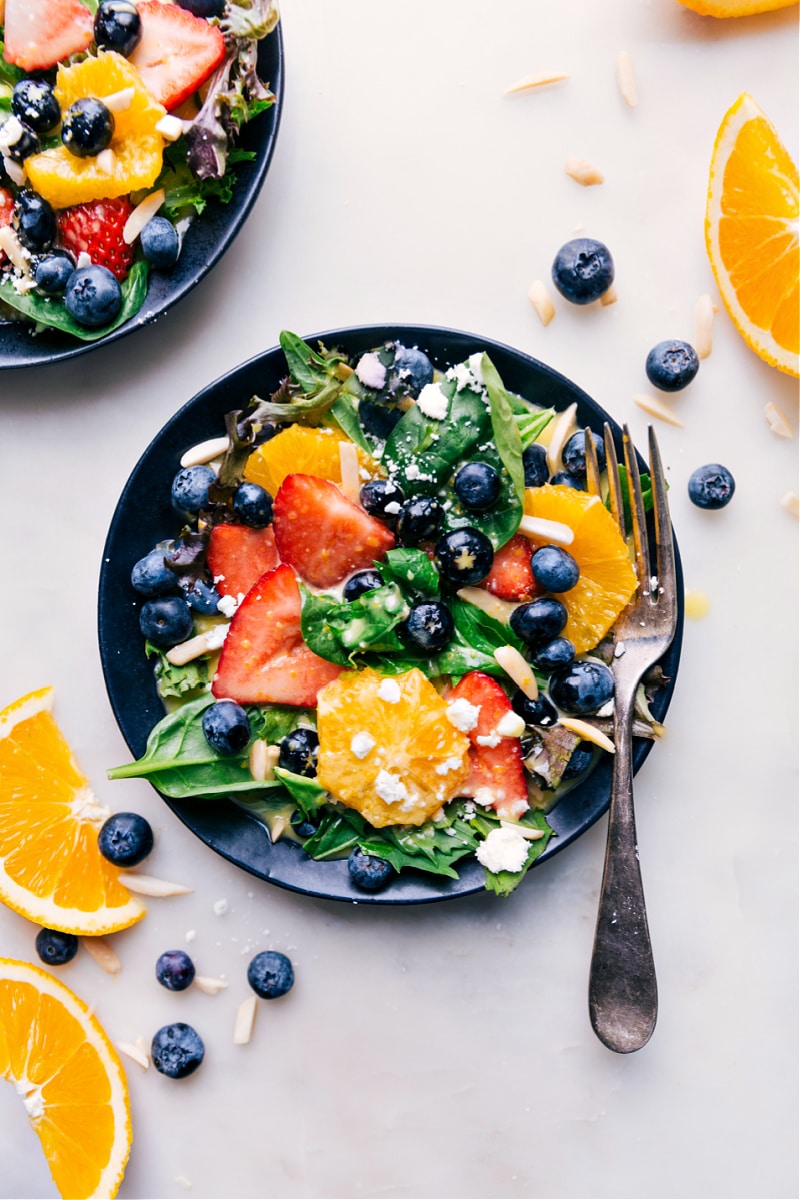 Overhead image of a fully dressed salad