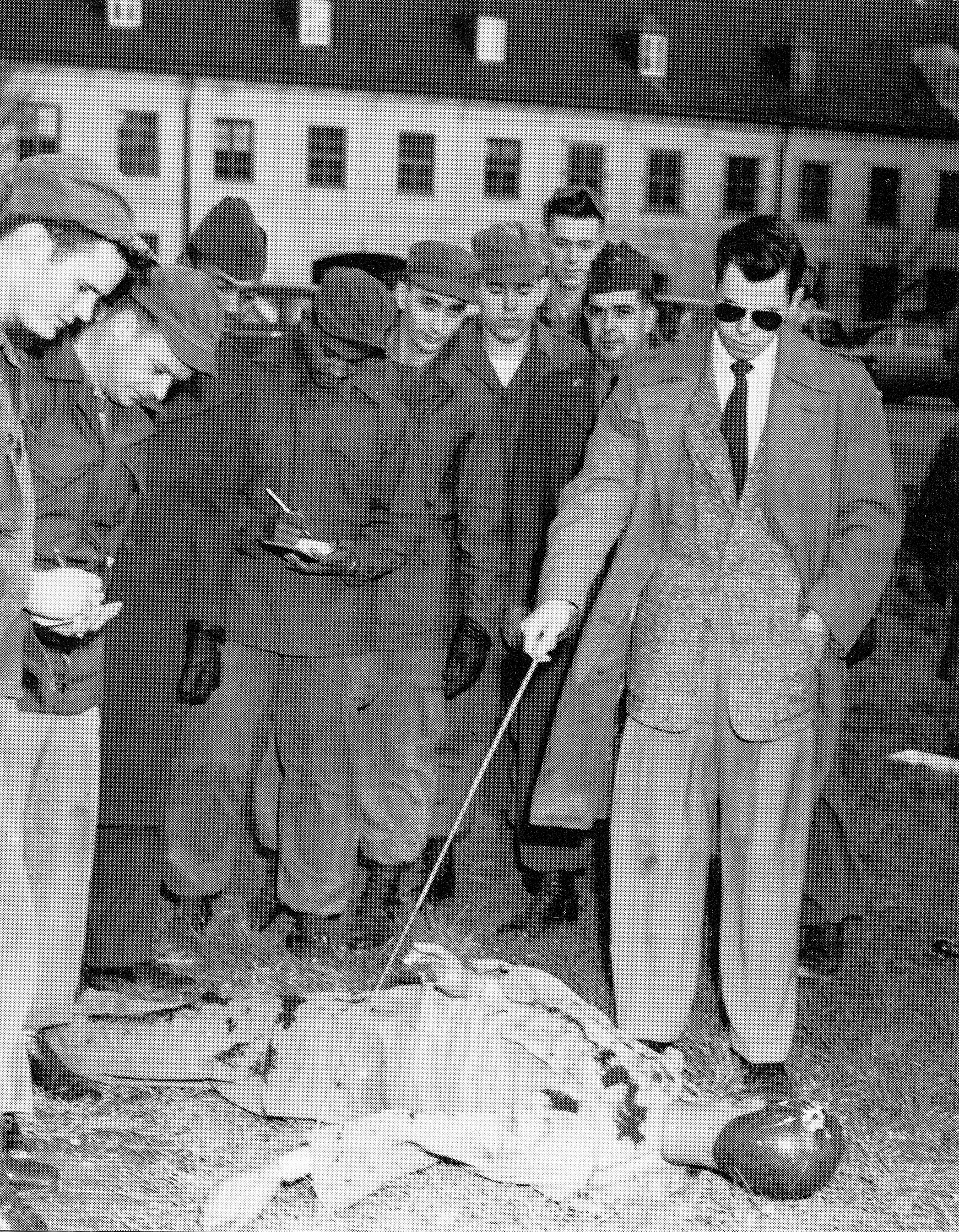 Black and white photo of Army CID Special Agent giving training to soldiers in Korea War era uniforms