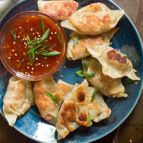 Close Up of a Plate of Tofu Dumplings with Sweet Chili Dipping Sauce