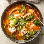 Bowl of Korean Tofu Soup with spoon.