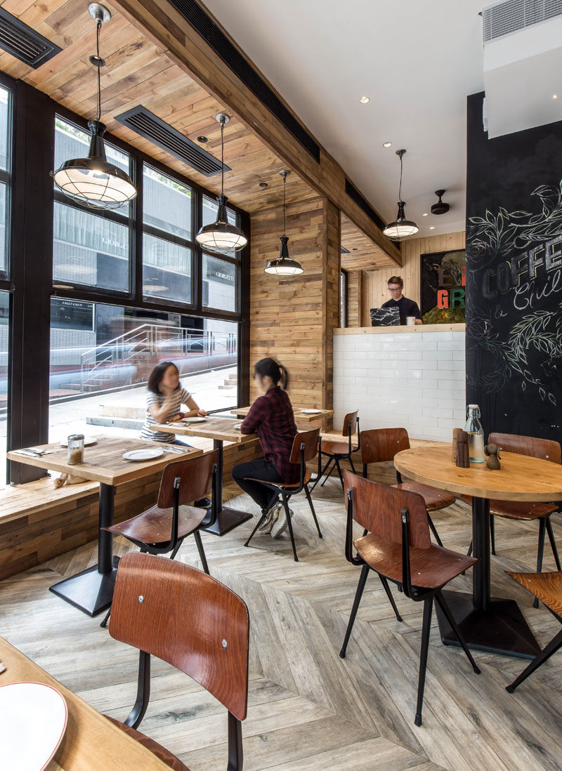 Black details contrast the wood and white details used throughout this coffee shop.