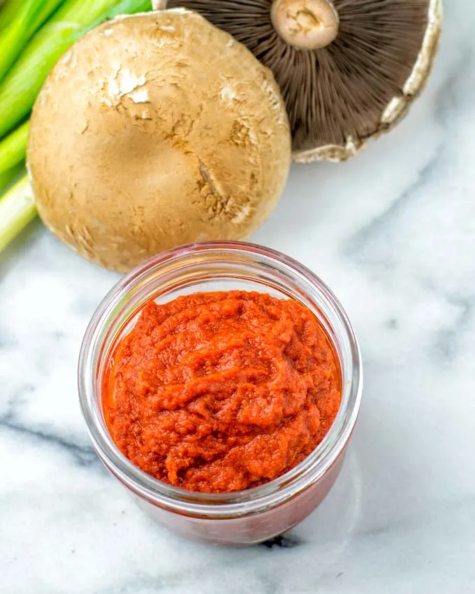 To make this Red Curry Paste you need tomato paste, minced garlic. onions, red chilis, and a spice mix.