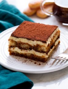 Slice of homemade tiramisu on a dessert plate.