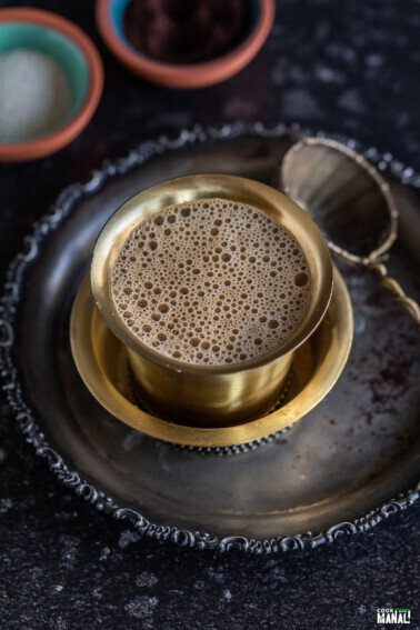 tumbler filled with frothy coffee