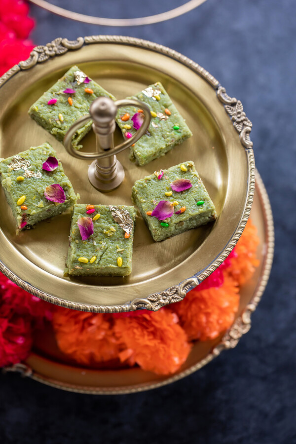 paan kalakand served on a golden two tier serving platter