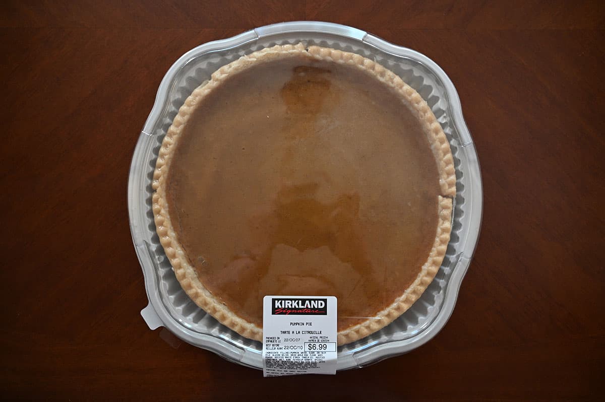 Image of the Kirkland Signature Pumpkin Pie sitting on a table unopened.