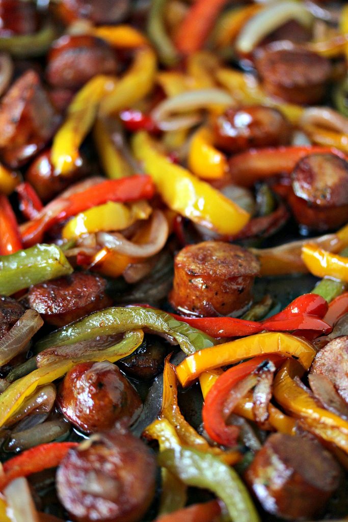 Sheet Pan Sausage and Peppers from cravingsofalunatic.com- This recipe is simple to make yet full of flavour. It's perfect to eat on its own, or pile it high on a hoagie bun. One pan, a few simple ingredients, and you have the perfect lunch or dinner recipe. (@CravingsLunatic)