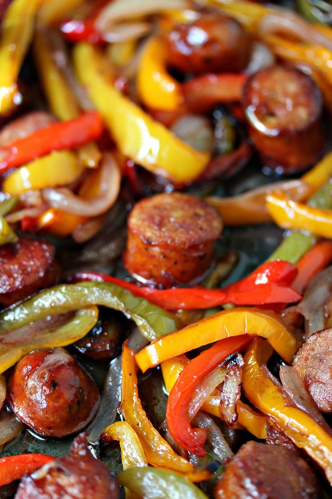 Sheet Pan Sausage and Peppers from cravingsofalunatic.com- This recipe is simple to make yet full of flavour. It's perfect to eat on its own, or pile it high on a hoagie bun. One pan, a few simple ingredients, and you have the perfect lunch or dinner recipe. (@CravingsLunatic)