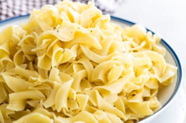 A bowl of buttered noodles.