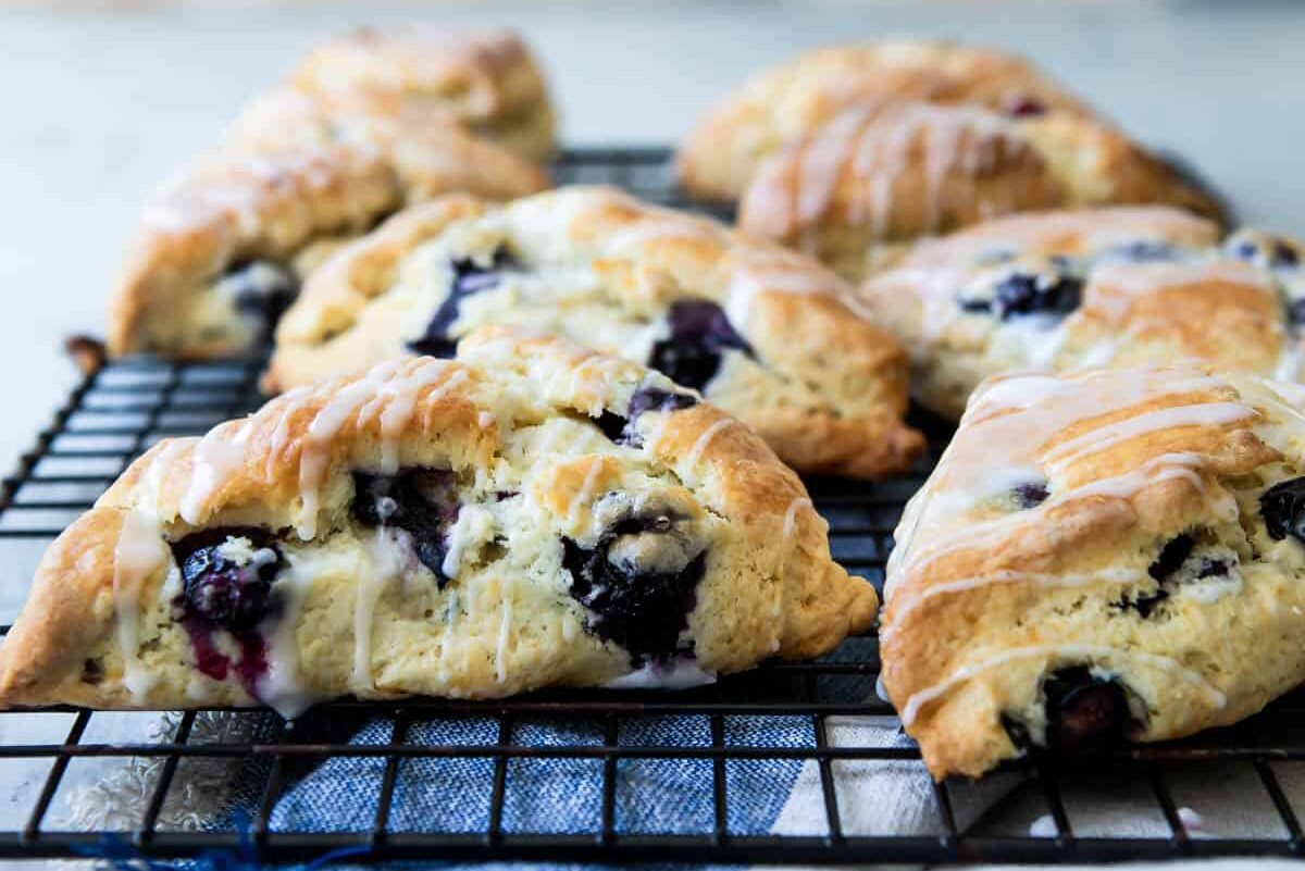 Blueberry scones on a cooling rack.