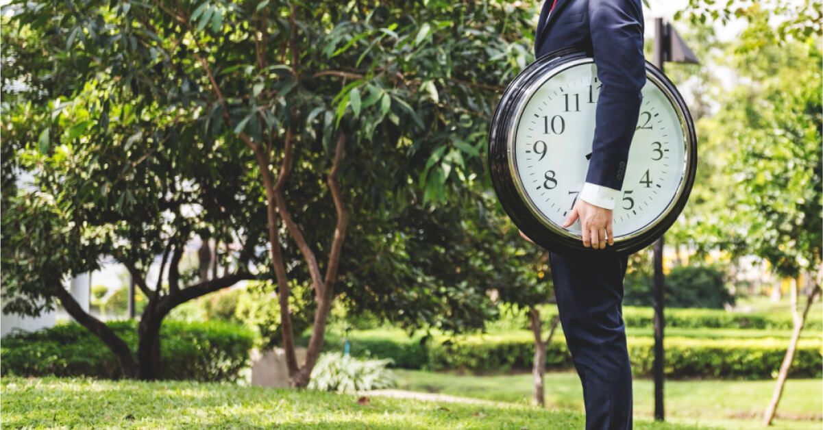 A man carrying a clock