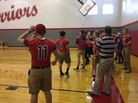 boys varsity football lined up for passing challenge