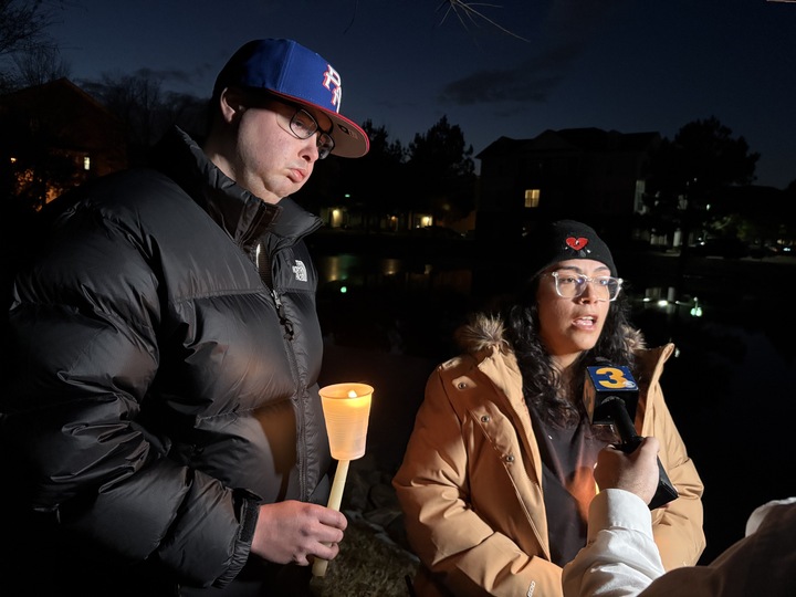 Jason Lopez and his fiancee, Courtney Rivera, stand near the pond where the body of 12-year-old Juan Sebastian Mejia Acevedo was found on Jan. 27, 2005, three days after he was reported missing.