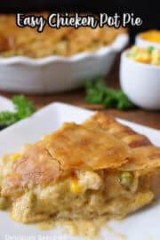 A slice of easy chicken pot pie on a square white plate.