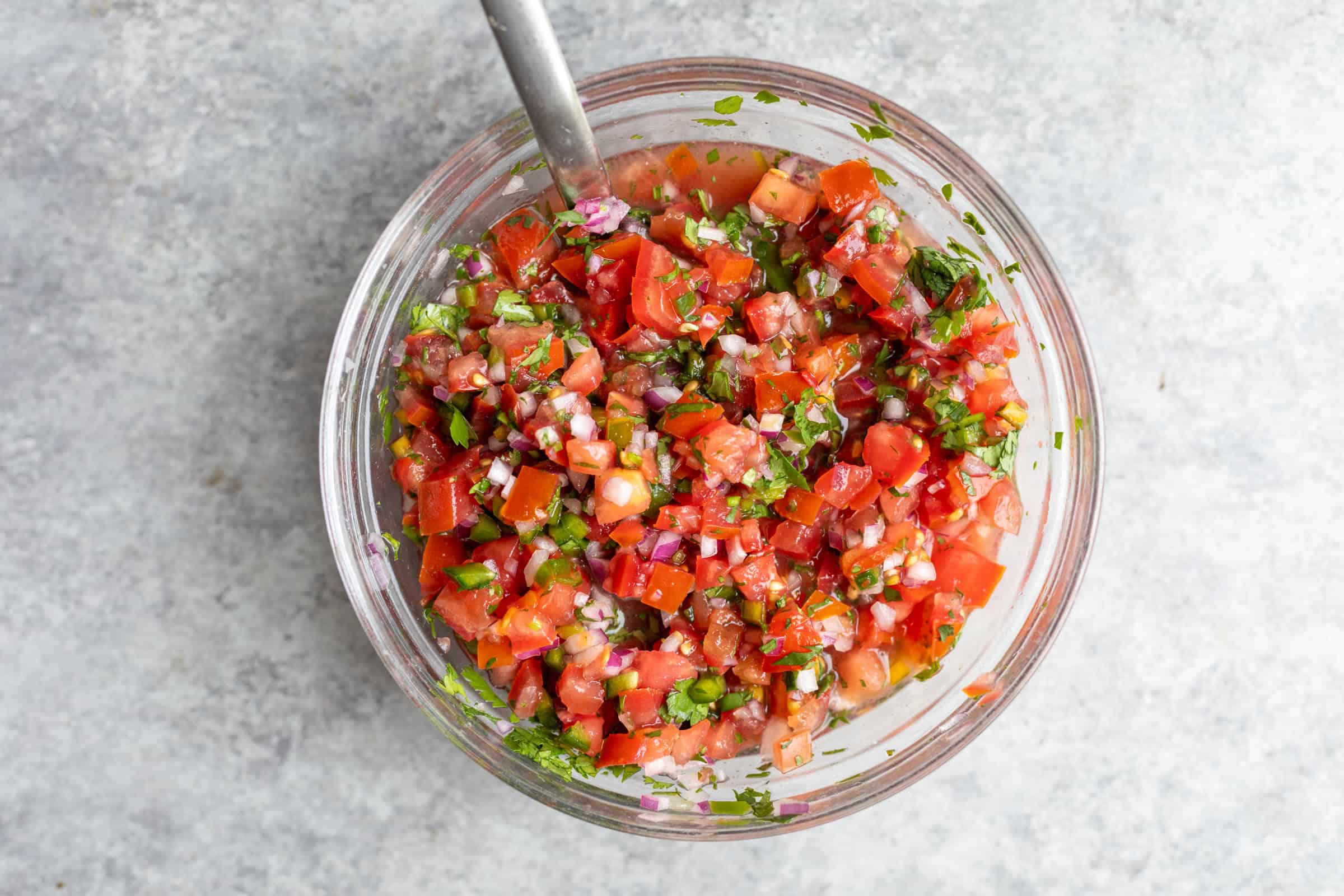 A Bowl Of Freshly Made Pico De Gallo, Featuring Diced Tomatoes, Onions, And Cilantro, Mixed Thoroughly, Viewed From Above, Perfect For Topping Vegan Potato And Chorizo Tacos.