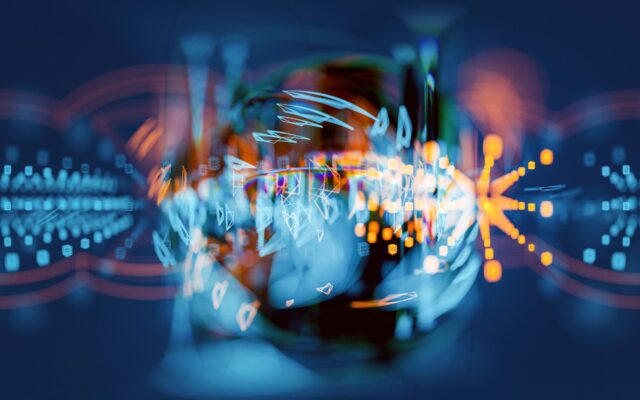 Abstract image of a sphere with light moving through it against a blurred soft blue and red background.