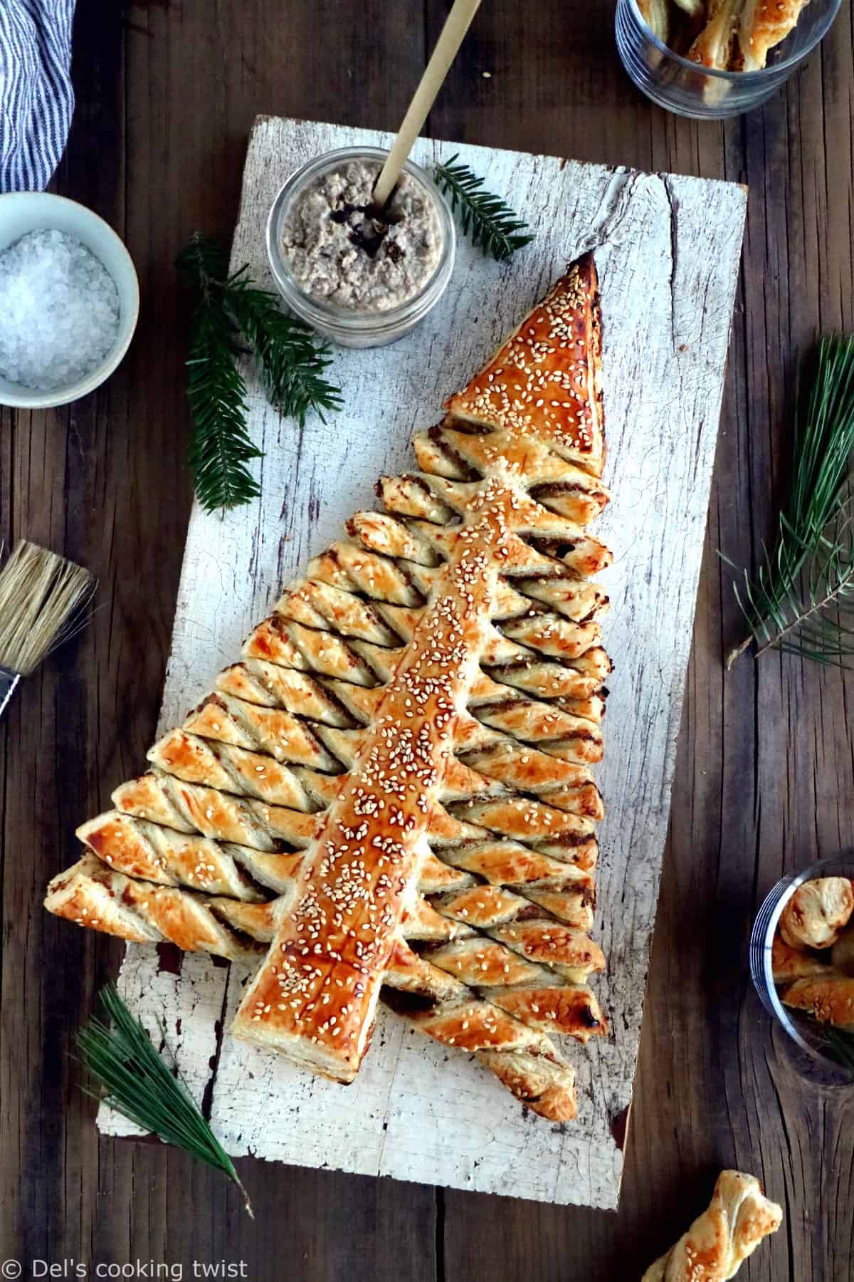 Puff pastry Christmas tree is a festive holiday appetizer with pull-apart breadsticks filled with savory toppings of your choice. Easy to make and delicious, it is sure to impress at your next Christmas party!