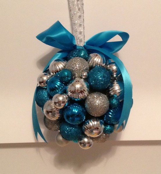 a Christmas decoration of silver and tiffany blue ornaments plus a blue bow on top is a chic idea you can easily make yourself