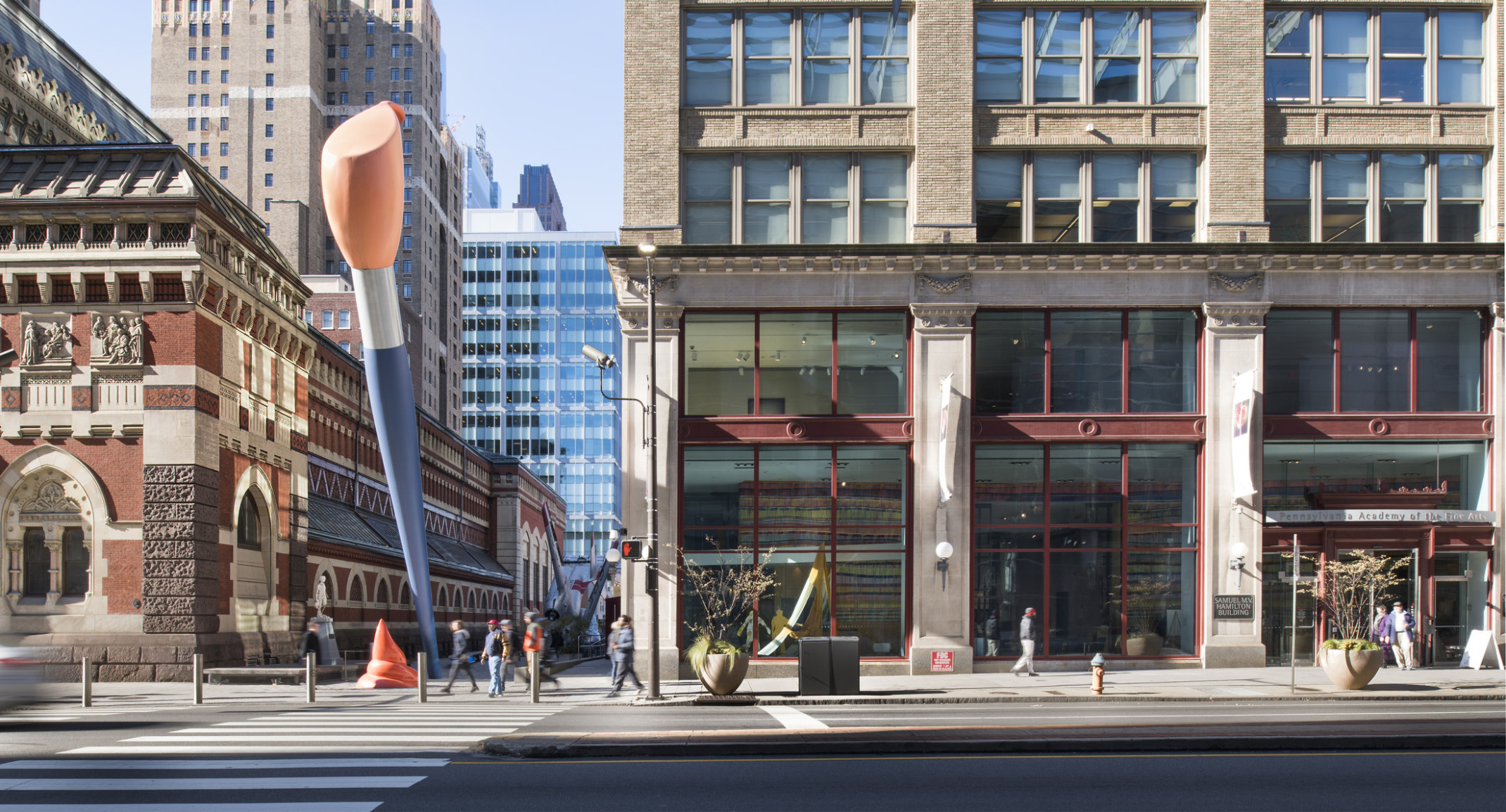 street view of Pennsylvania Academy of the Fine Arts building with two story blue and orange paint brush sculpture outside