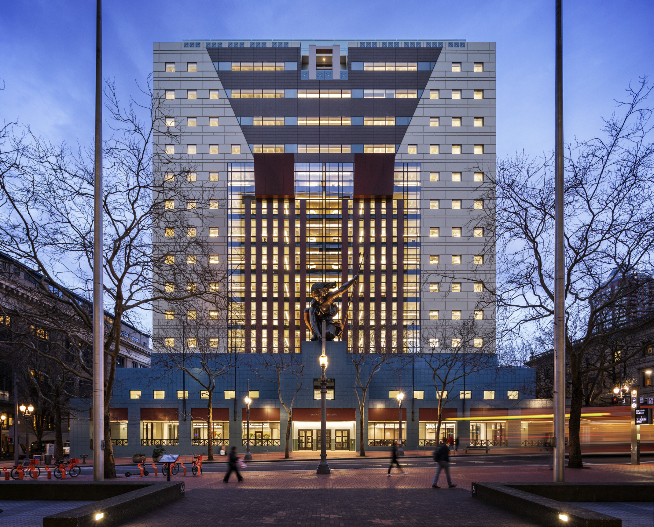 The Portland Building illuminated at dusk following renovation, portland building renovation, restoration, postmodern architecture, michael graves architecture