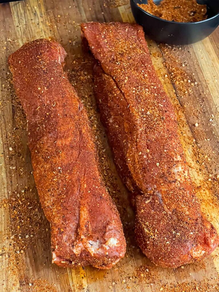 Two pork tenderloins rubbed with a Memphis style rub.