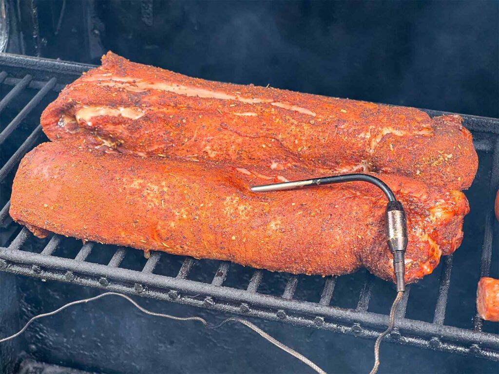 Two pork tenderloins in the smoker.