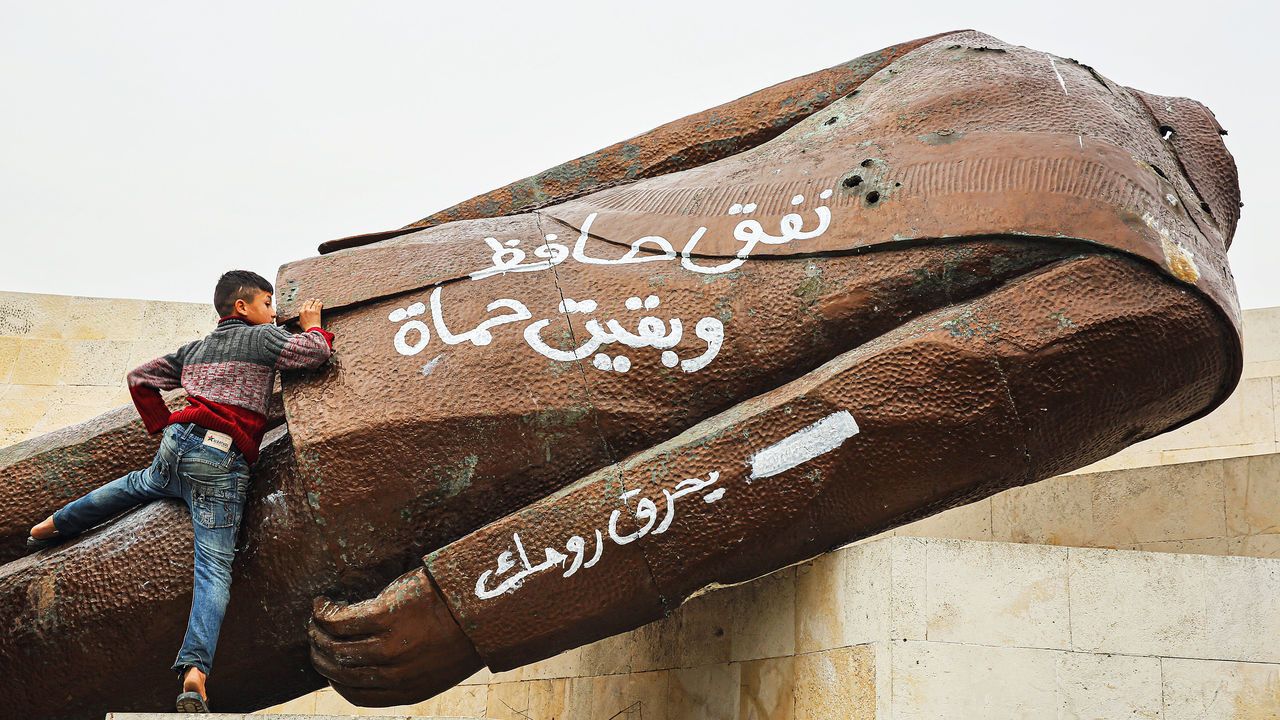 The torn down statue of former Syrian president Hafez al-Assad.