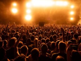 back view crowd fans watching live performance music concert night