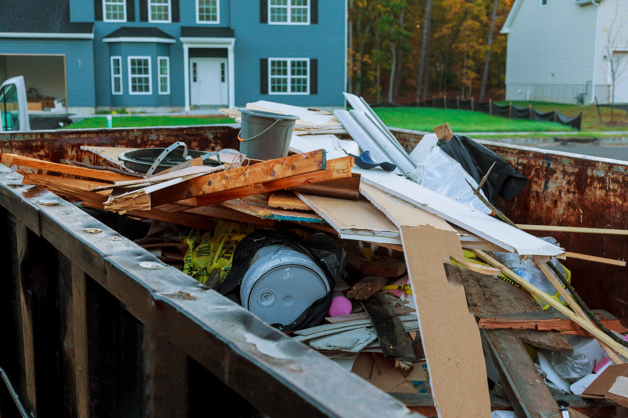 roll off Dumpster filled with trash of different types