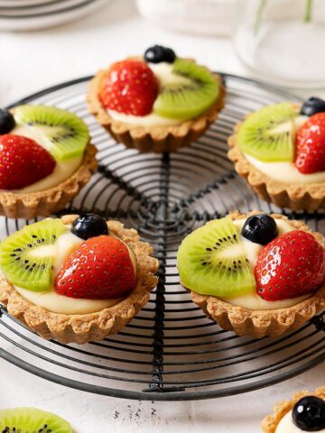 Healthier fruit tarts on a rack