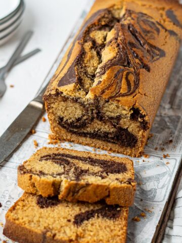 A loaf and a few slices of gluten free marble cake