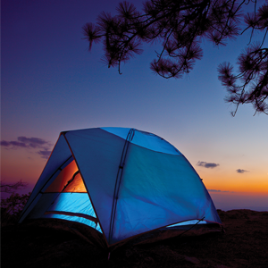 A blue camping tent at dusk