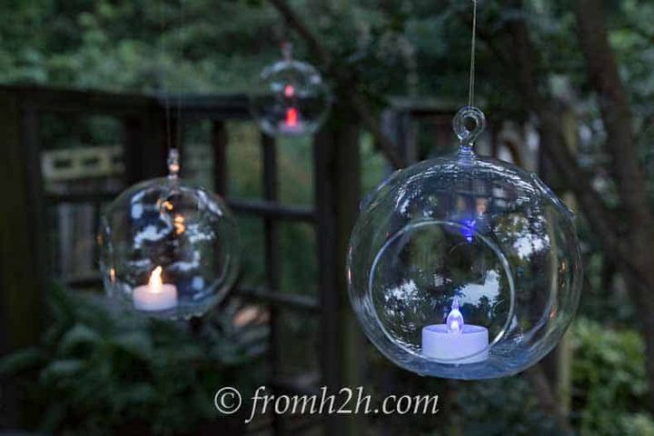 Red, white and blue tealights hanging from trees add to the July 4 atmosphere.