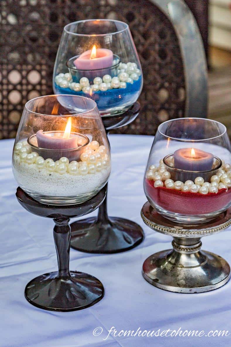 Red white and blue colored sand used in a candleholder