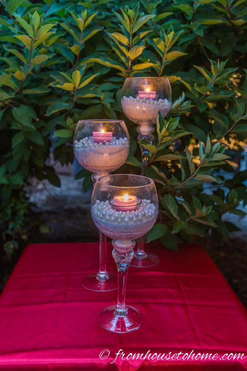 4th of July decor with a red table cloth with white and blue candles