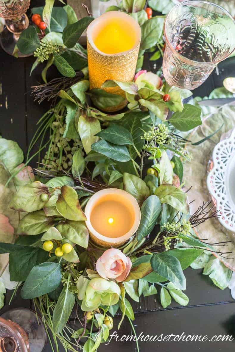 Candles and greenery finish off the Easter table decorations