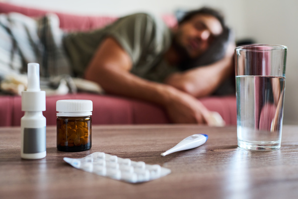 On the Table There Are Pills a Spray and a Glass of Water