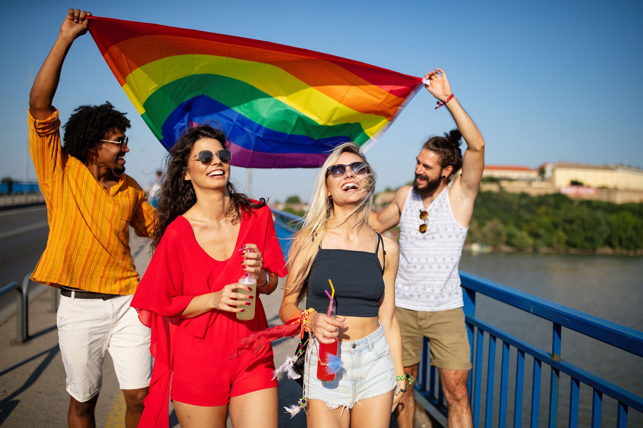 People in casual attire holding Unity flag