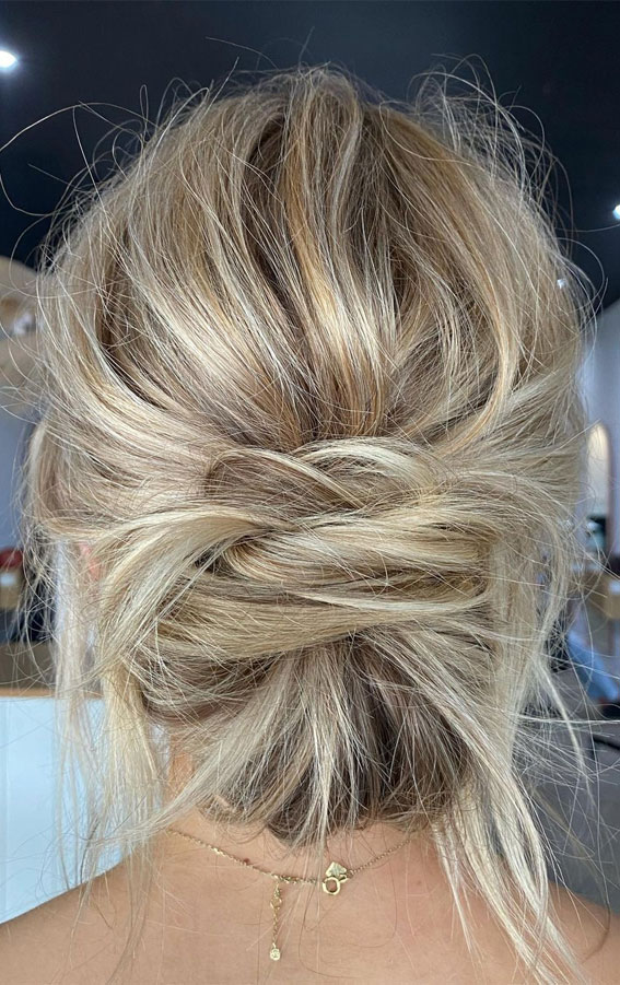 50 Best Updo Hairstyles For Trendy Looks in 2022 : Messy Windblown Low Bun