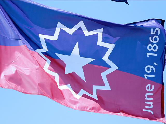 The Juneteenth flag, commemorating the day that slavery ended in the U.S., flies in Omaha, Neb., June 17, 2020. (AP Photo/Nati Harnik)