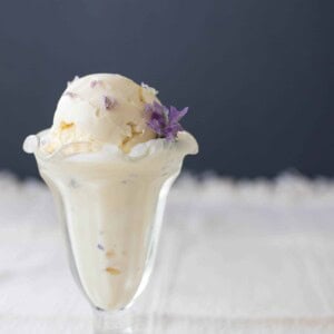 lavender ice cream in a glass Sunday cup with a Lavender flower in the ice cream.