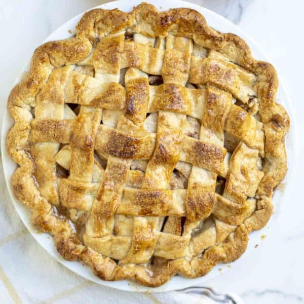 A golden brown pie on a white countertop.